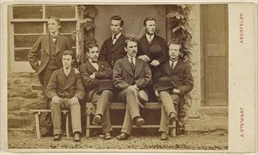 Group of seven  men: four seated, three standing, some holding hats; A. Stewart, British, active 1880s, about 1865; Albumen