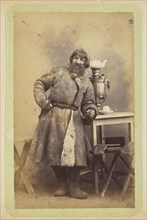Man in coat leaning on table; William Carrick, Scottish, 1827 - 1878, Russia; about 1860 - 1870; Albumen silver print