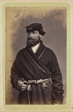 Man posing in dark coat and sash; William Carrick, Scottish, 1827 - 1878, Russia; about 1860 - 1870; Albumen silver print