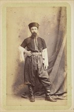 Man posing in tunic and wide pants; William Carrick, Scottish, 1827 - 1878, Russia; about 1860 - 1870; Albumen silver print