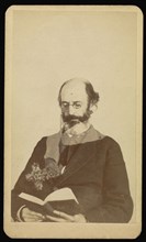 balding, bearded man reading while seated; William H. Mumler, American, 1832 - 1884, Boston, Massachusetts, United States; 1862
