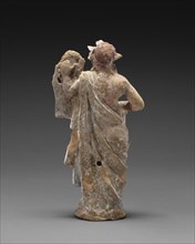 Statuette of Apollo; Canosa, South Italy; 200 - 100 B.C; Terracotta with white slip and polychromy, purple, pink, white, light