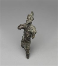 Statuette of a Bugler; Roman Empire; 1st - 2nd century; Bronze; 14.1 × 5 × 9 cm, 5 9,16 × 1 15,16 × 3 9,16 in