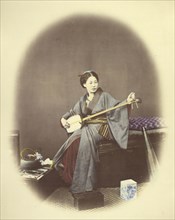 Girl Playing the Samisen; Felice Beato, 1832 - 1909, Japan; 1866 - 1867; Hand-colored Albumen silver print