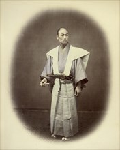 Japanese Yakonin in Dress of Ceremony; Felice Beato, 1832 - 1909, Japan; 1866 - 1867; Hand-colored Albumen