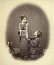 Putting on the Obi, or Gridle; Felice Beato, 1832 - 1909, Japan; 1866 - 1867; Hand-colored Albumen silver