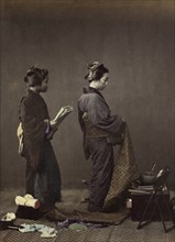 Putting on the Obi, or Girdle; Felice Beato, 1832 - 1909, Japan; 1866 - 1867; Hand-colored Albumen silver