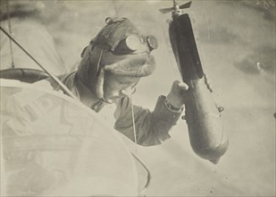 Man in airplane dropping a bomb; Fédèle Azari, Italian, 1895 - 1930, Italy; 1914 - 1918; Gelatin silver print; 11.3 x 16 cm