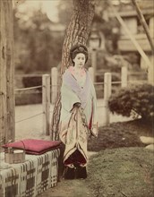 Girl standing near tree; Kusakabe Kimbei, Japanese, 1841 - 1934, active 1880s - about 1912, Japan; 1870s - 1890s; Hand-colored