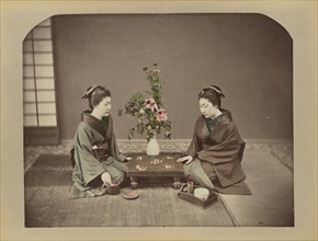 Geisha Playing at Go; possibly Baron Raimund von Stillfried, Austrian, 1839 - 1911, Japan; 1870s - 1890s; Hand-colored Albumen