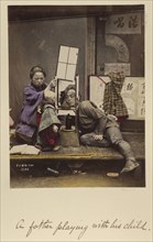 A father playing with his child; Shinichi Suzuki, Japanese, 1835 - 1919, Japan; about 1873 - 1883; Hand-colored Albumen silver