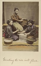 Grinding the rice into flour; Shinichi Suzuki, Japanese, 1835 - 1919, Japan; about 1873 - 1883; Hand-colored Albumen silver