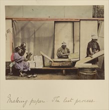 Making Paper - The Last Process; Shinichi Suzuki, Japanese, 1835 - 1919, Japan; about 1873 - 1883; Hand-colored Albumen silver