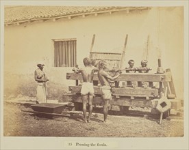Pressing the fecula; Oscar Mallitte, British, about 1829 - 1905, active Allahabad, India 1870s, Allahabad, India; 1877; Albumen