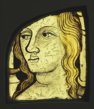 Female Head; English?; England, ?, about 1420 - 1430; Colorless glass, vitreous paint, and silver stain; 15.4 x 11.9 x 1 cm