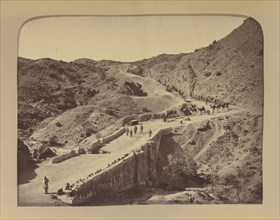 Soldiers and camels crossing bridge; John Burke, British, active 1860s - 1870s, Afghanistan; 1878 - 1879; Albumen silver print
