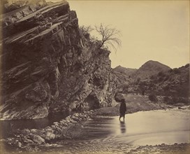 Man standing in water near river; John Burke, British, active 1860s - 1870s, Afghanistan; 1878 - 1879; Albumen silver print