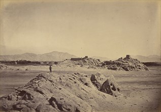 Man standing on rocks; John Burke, British, active 1860s - 1870s, Afghanistan; 1878 - 1879; Albumen silver print