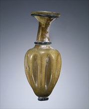 Yellow Oinochoe with body indentations; Roman Empire; 4th century; Glass; 13 x 5.5 cm, 5 1,8 x 2 3,16 in