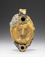 Lamp with Mask overlaid with gold foil; Roman Empire; 1st century B.C. - 1st century A.D; Glass, gold; 7 x 2.4 cm
