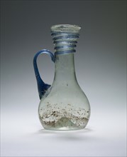 Pale Green Pitcher with blue trail and handle; Eastern Mediterranean; 4th - 5th century; Glass; 10.5 x 5.2 cm, 4 1,8 x 2 1,16 in