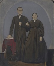 Portrait of standing couple; United States; 1860s - 1880s; Hand-colored tintype; Sheet: 25.5 x 20.1 cm, 10 1,16 x 7 15,16 in