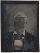 Portrait of man with large bow tie; United States; 1860s - 1880s; Hand-colored tintype; Sheet: 21.9 x 16.6 cm, 8 5,8 x 6 9,16 in