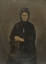 Portrait of woman in bonnet; United States; 1860s - 1880s; Hand-colored tintype; Sheet: 35.8 × 25.6 cm, 14 1,8 × 10 1,16 in