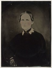 Portrait of woman; United States; 1860s - 1880s; Hand-colored tintype; Sheet: 21.6 × 16.5 cm, 8 1,2 × 6 1,2 in