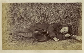 Boy sleeping next to haystack; Ronald Ruthven Leslie-Melville, Scottish,1835 - 1906, England; 1860s; Albumen silver print