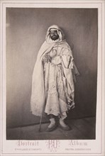 Algerian man with staff, Cities and sites cabinet card collection, Veuve Plasse et Oberty, Albumen, after 1867, Portrait Album