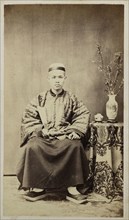 Seated Chinese man; recto, collection of photographs of China and Southeast Asia, Ye-Chung, ca. 1860