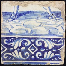 Tile, in blue on white, under ornament edge, above it legs of soldier with shoes, tile picture footage fragment ceramics pottery