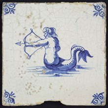 Scene tile, naked man with fish tail and bow and arrow, in blue on white, corner pattern ox head, wall tile tile sculpture