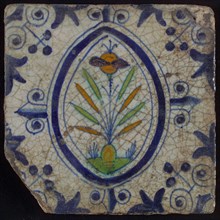 Tile, flower on spot in blue, green, orange and purple on white, inside an oval with lilies, corner design, wall tile
