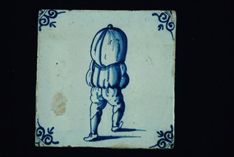 Profession tile, blue with sack carrier seen on the back, corner motif ox's head, wall tile tile sculpture ceramic earthenware