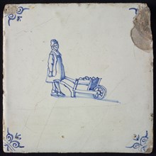 Occupation tile, blue with standing man with wheelbarrow, corner motif oxen head, wall tile tile sculpture ceramic earthenware