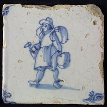 Occupation tile, blue with brazier with hammer, corner motif of ox's head, wall tile tile sculpture ceramic earthenware glaze
