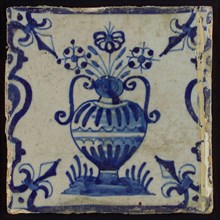 Flowerpot, flowerpot between balusters in blue on white, corner pattern french lily, white paint on the tile, wall tile