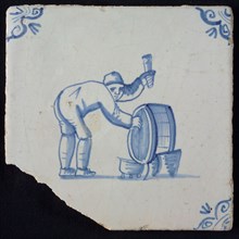 Occupation tile, blue with bent man, cooper with barrel, corner motif ox's head, wall tile tile sculpture ceramics pottery glaze