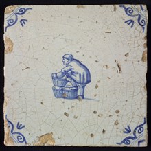 Occupation tile, blue with basket-maker, corner motif of ox-head, wall tile tile sculpture ceramic earthenware glaze, baked 2x