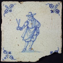 Occupation tile, blue with tailor, dressed man with scissors in hand, corner motif oxen head, wall tile tile sculpture ceramic