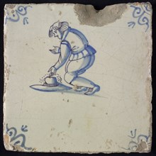 Scene tile, child's play, bowing with marbles, corner motif of ox's head, wall tile tile sculpture ceramic earthenware glaze