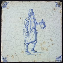 Figure tile, blue with standing man with beer jug, corner motif oxen head, wall tile tile sculpture ceramic earthenware glaze