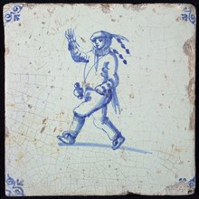 Figure tile, blue with running and waving jester with beer jug on carrying strap, corner motif oxen head, wall tile