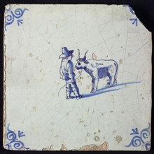 Figure tile, blue with farmer with cow, corner motif oxen head, wall tile tile sculpture ceramic earthenware glaze, baked 2x