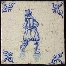 Figure tile, blue with skating man, with breeches and top hat, corner pattern ox-head, wall tile tile sculpture ceramic
