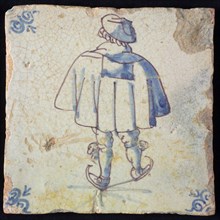 Figure tile, blue with skating man, with wide cape, seen on the back, corner pattern ox head, wall tile tile sculpture ceramic