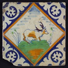 Animal tile, kneeling deer on small ground within square with palm corner in green, yellow, brown and blue on white, wall tile