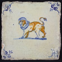 Animal tile, lion facing left looking at us in blue and brown on white, corner motif of ox-head, wall tile tile sculpture